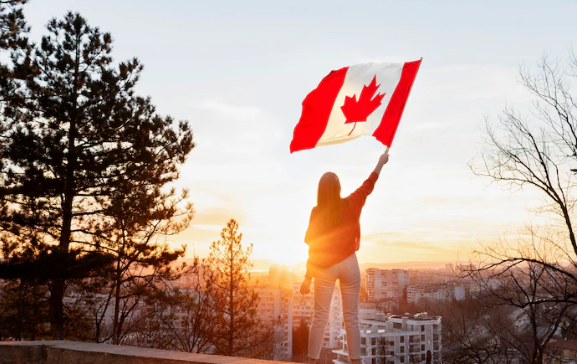 A woman raising the flag of canada in the list of places where adderall is legal
